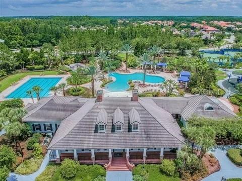 8237 Dunham Station Drive Tampa, FL 33647 - Photo 31 of 33 an aerial view of a house with a garden