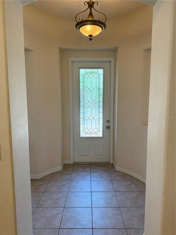 8237 Dunham Station Drive Tampa, FL 33647 - Photo 6 of 33 a view of an empty room with a window