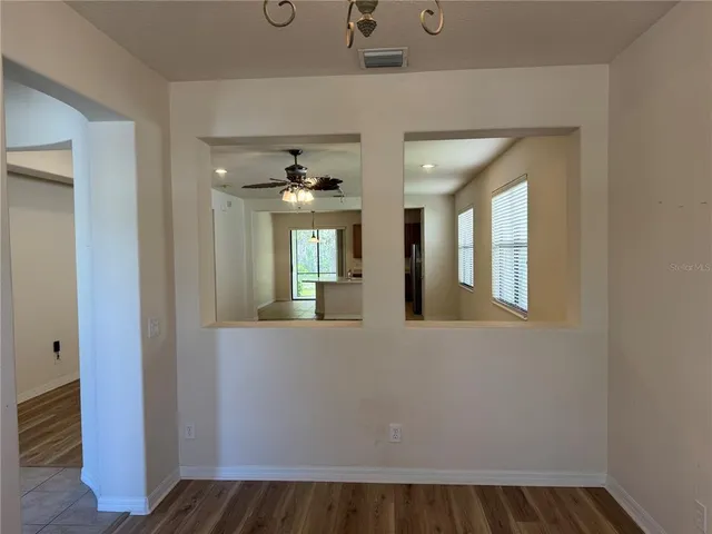 a view of an entryway with wooden floor