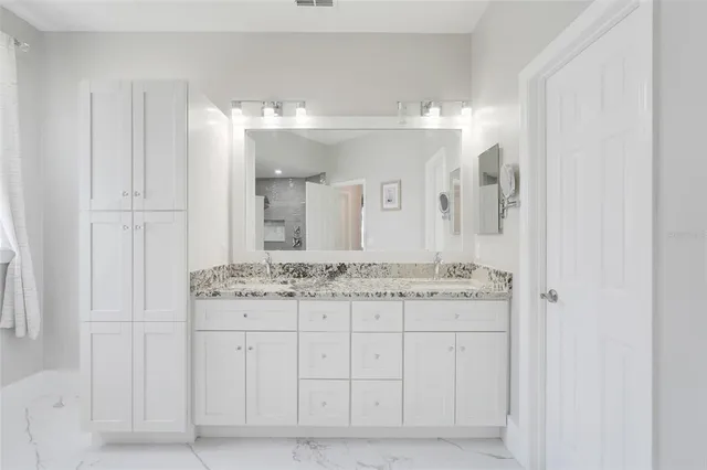 a kitchen with stainless steel appliances a refrigerator and a stove top oven