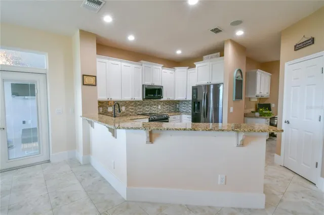 an aerial view of a swimming pool and outdoor space