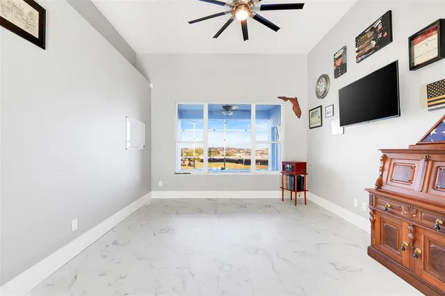 a bedroom with furniture and a window