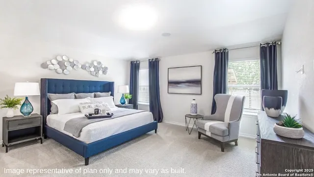 a bedroom with a bed and a couch