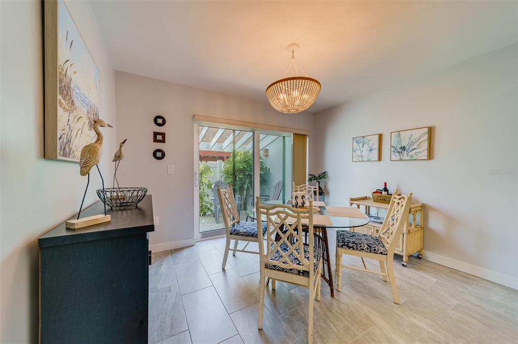 1 Windrush Boulevard, Unit 63 Indian Rocks Beach, FL 33785 - Photo 12 of 60 a view of a livingroom with furniture and window