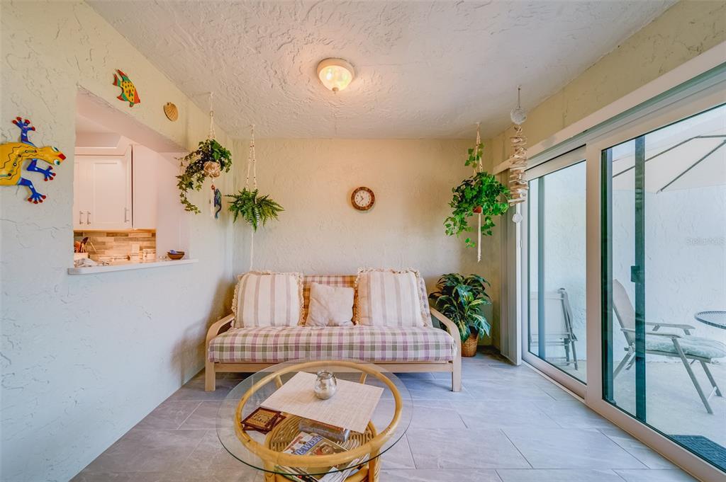 1 Windrush Boulevard, Unit 63 Indian Rocks Beach, FL 33785 - Photo 14 of 60 a view of entryway with paintings on the wall