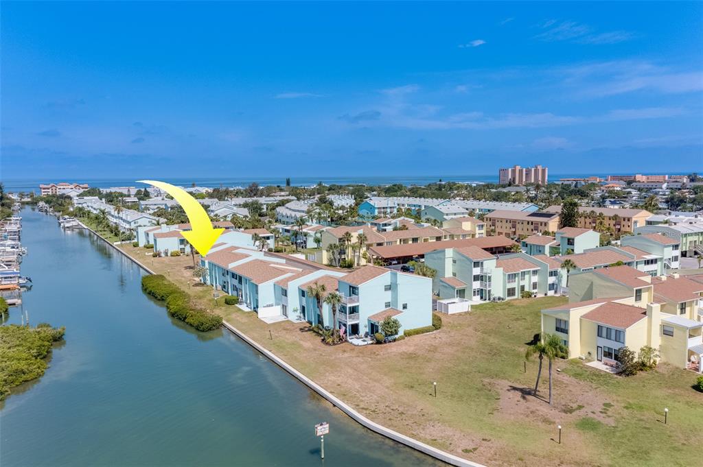 1 Windrush Boulevard, Unit 63 Indian Rocks Beach, FL 33785 - Photo 2 of 60 an aerial view of a house with a swimming pool