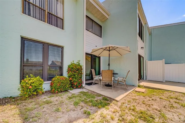 a view of a swimming pool and an outdoor seating