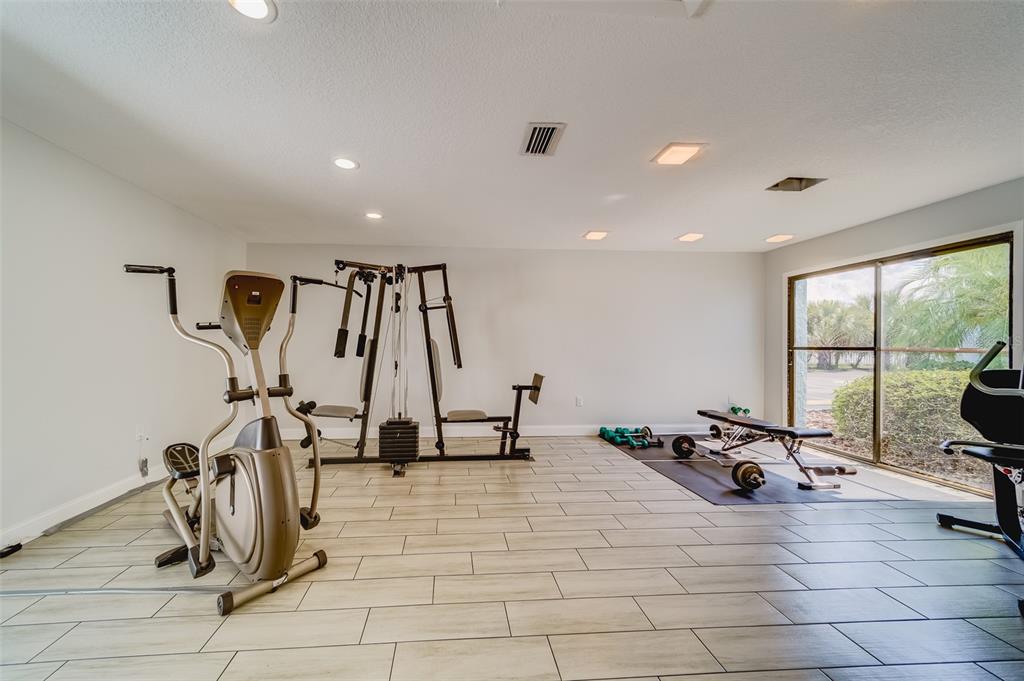 1 Windrush Boulevard, Unit 63 Indian Rocks Beach, FL 33785 - Photo 31 of 60 a view of a room with gym equipment