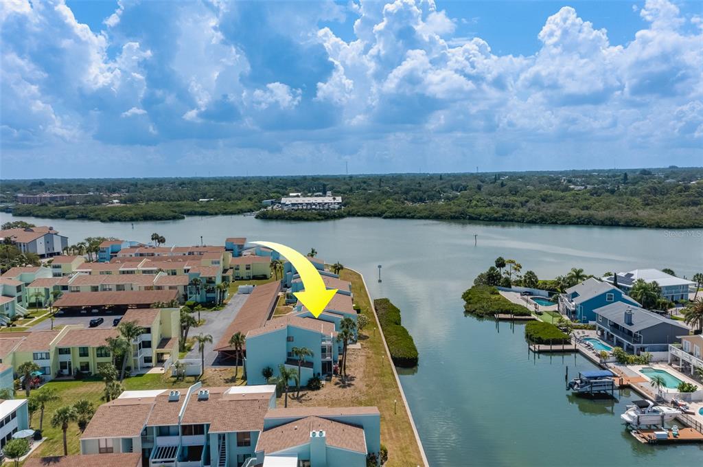 1 Windrush Boulevard, Unit 63 Indian Rocks Beach, FL 33785 - Photo 39 of 60 an aerial view of a city with lake view