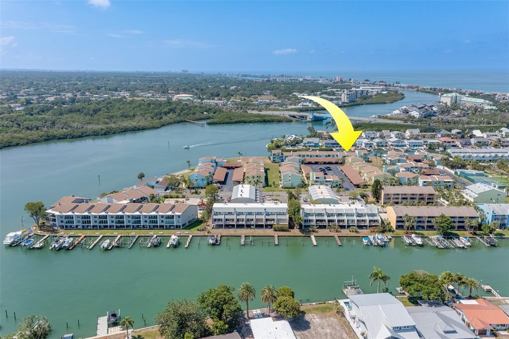 1 Windrush Boulevard, Unit 63 Indian Rocks Beach, FL 33785 - Photo 40 of 60 an aerial view of a city with a lake view