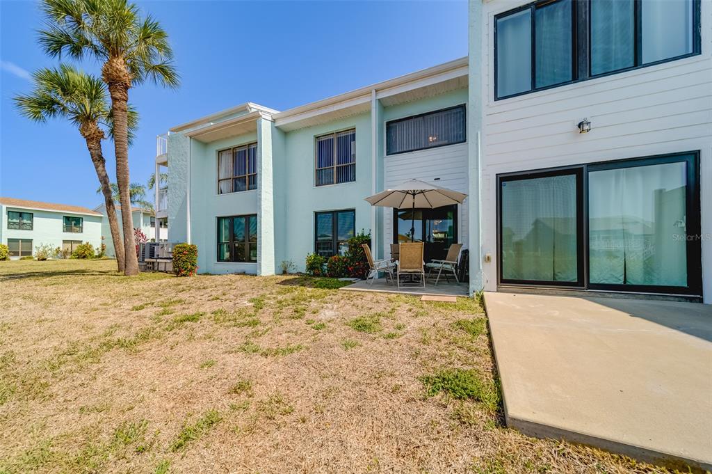 1 Windrush Boulevard, Unit 63 Indian Rocks Beach, FL 33785 - Photo 41 of 60 a house view with a outdoor space