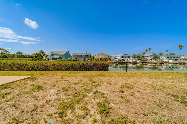 an aerial view of a house with a lake view