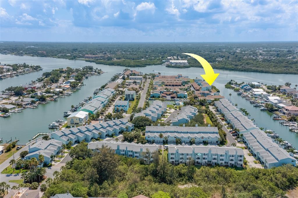 1 Windrush Boulevard, Unit 63 Indian Rocks Beach, FL 33785 - Photo 59 of 60 an aerial view of a house with a lake view
