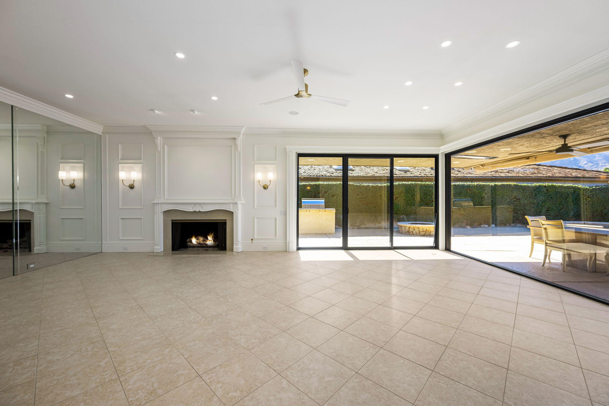 146 Yale Drive Rancho Mirage, CA 92270 - Photo 2 of 63 a view of an empty room with a fireplace and a large window