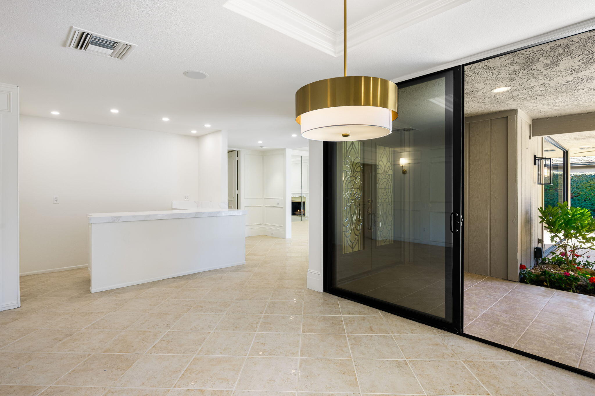 146 Yale Drive Rancho Mirage, CA 92270 - Photo 21 of 63 a view of a hallway with chandelier and glass door