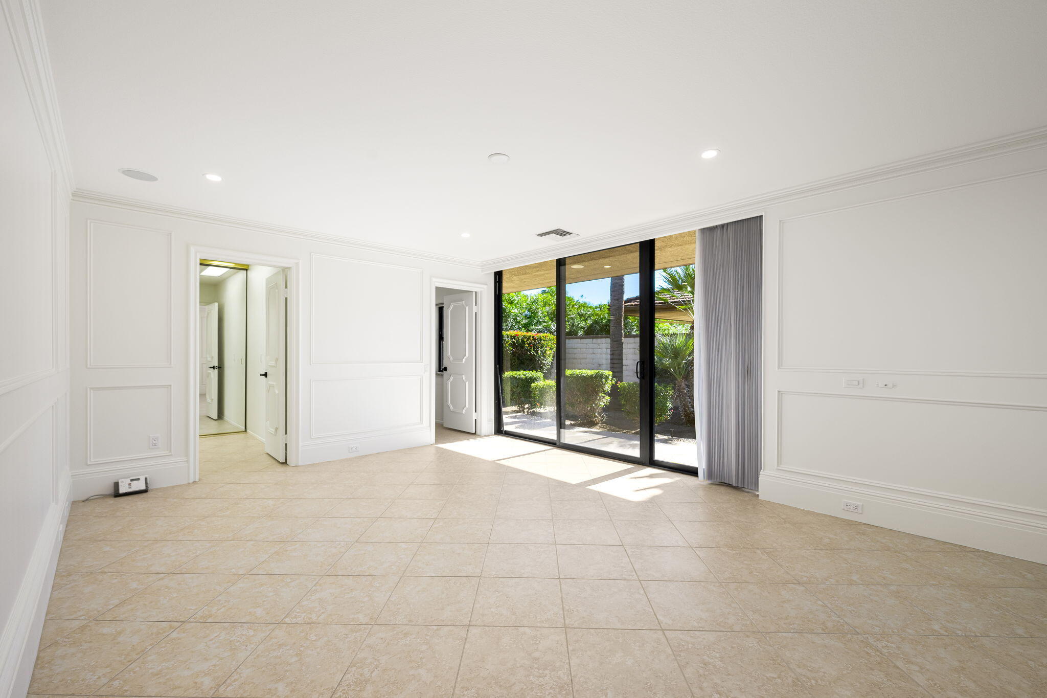 146 Yale Drive Rancho Mirage, CA 92270 - Photo 26 of 63 a view of an empty room with glass door