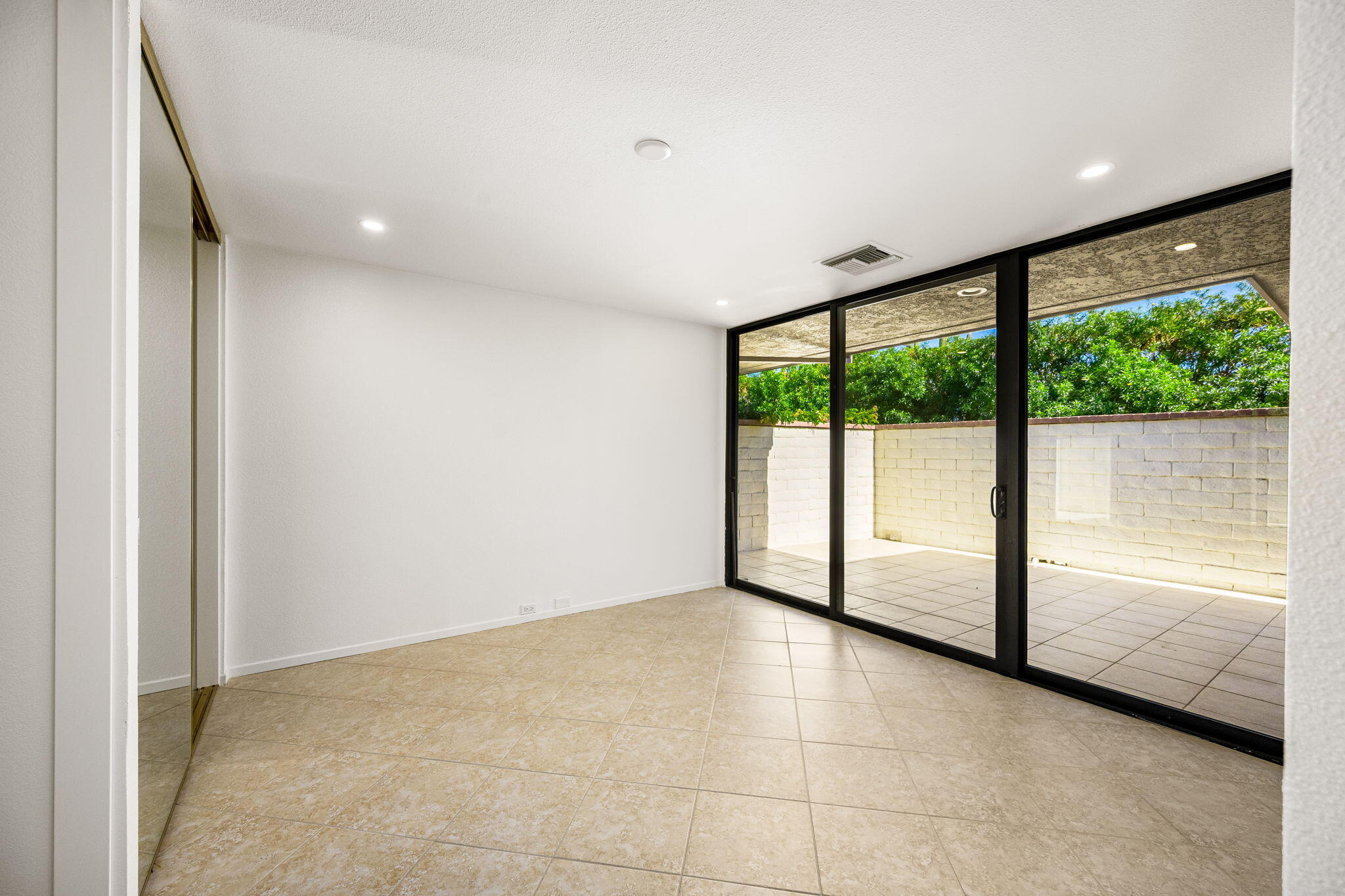 146 Yale Drive Rancho Mirage, CA 92270 - Photo 33 of 63 a view of empty room with large windows