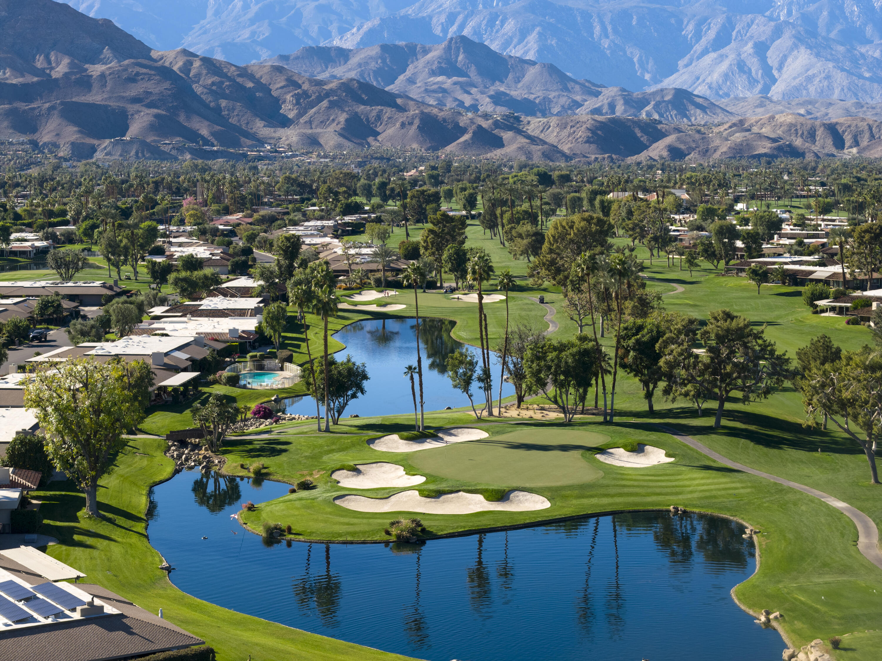 146 Yale Drive Rancho Mirage, CA 92270 - Photo 57 of 63 a view of a swimming pool with a yard
