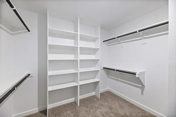 a view of an empty walk in closet