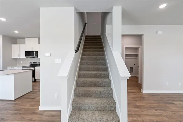a view of a kitchen with sink and cabinets
