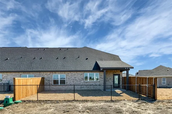 a front view of a house with basket ball court