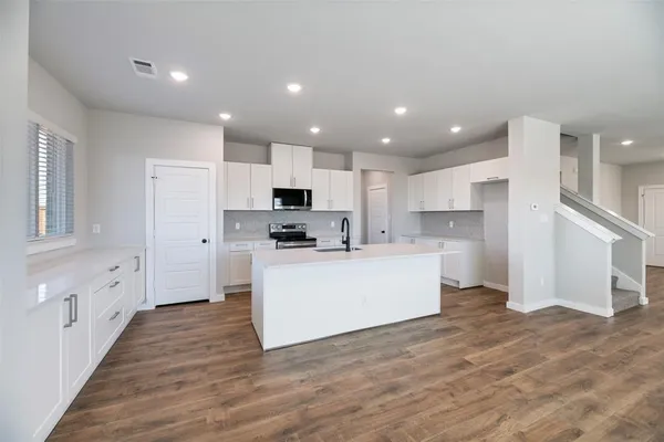 a view of kitchen with wooden floor