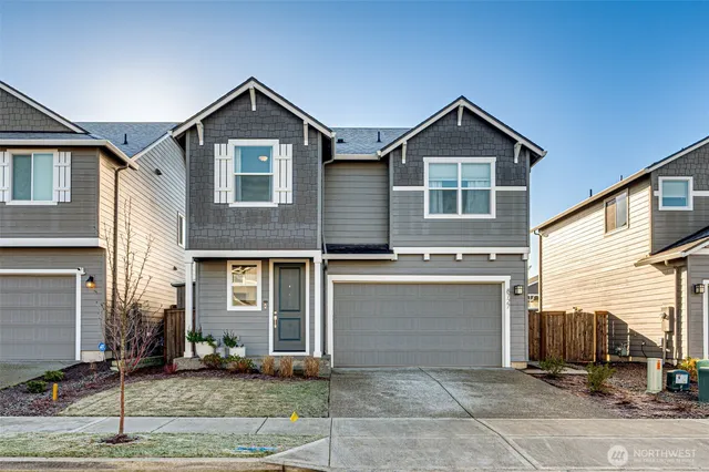 a front view of a house with yard