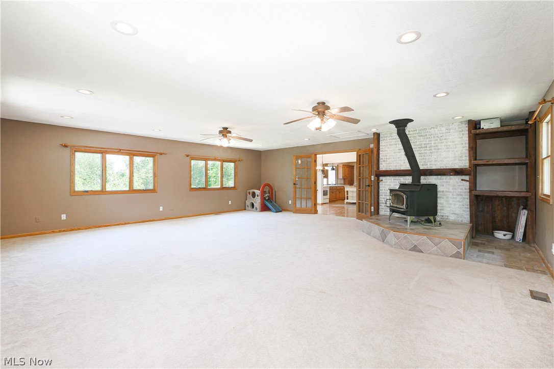 6475 Kungle Road Clinton, OH 44216 - Photo 5 of 35 Large Great Room with Wood Burner