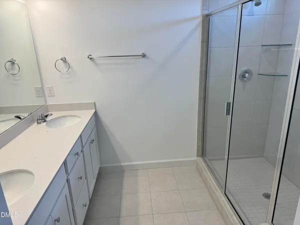 a view of a bathroom with a sink and a mirror