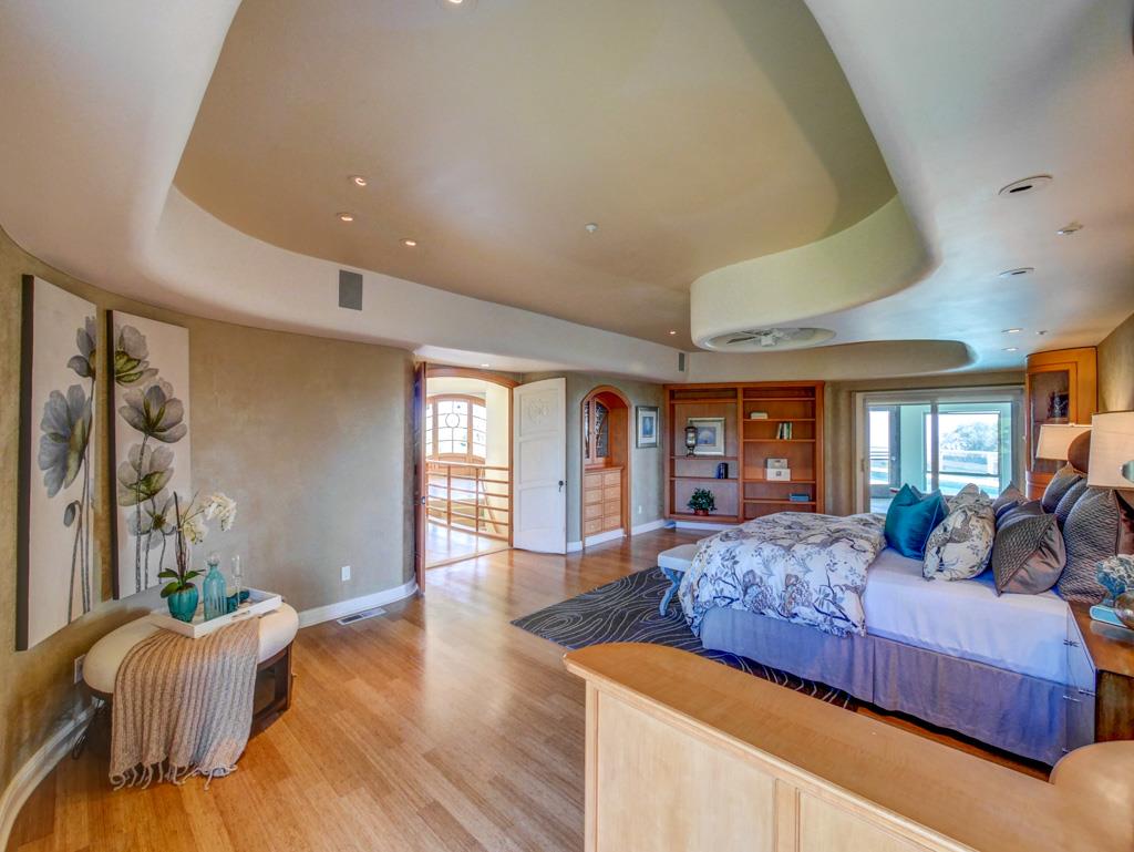 631 Quail Run Road Aptos, CA 95003 - Photo 15 of 39 a bedroom with bed and wooden floor