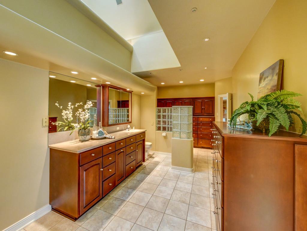 631 Quail Run Road Aptos, CA 95003 - Photo 17 of 39 a kitchen with stainless steel appliances granite countertop a large counter top a stove and a refrigerator