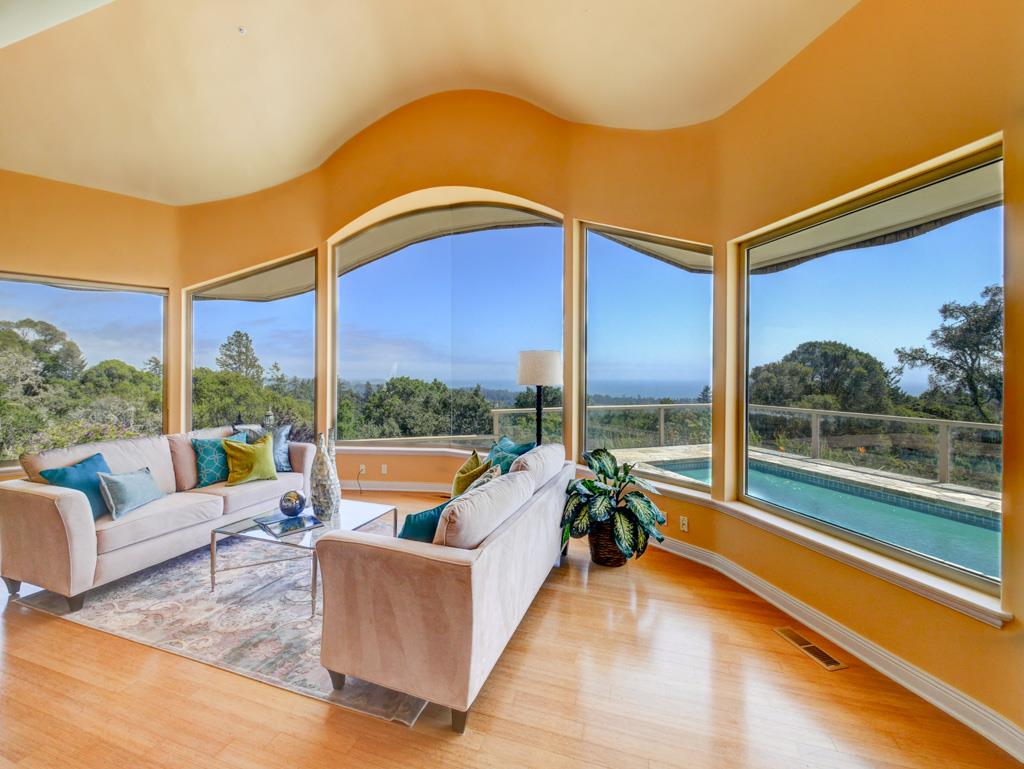 631 Quail Run Road Aptos, CA 95003 - Photo 6 of 39 a living room with patio furniture and a large window