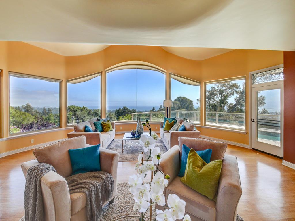 631 Quail Run Road Aptos, CA 95003 - Photo 10 of 39 a living room with furniture a large window and a flat screen tv