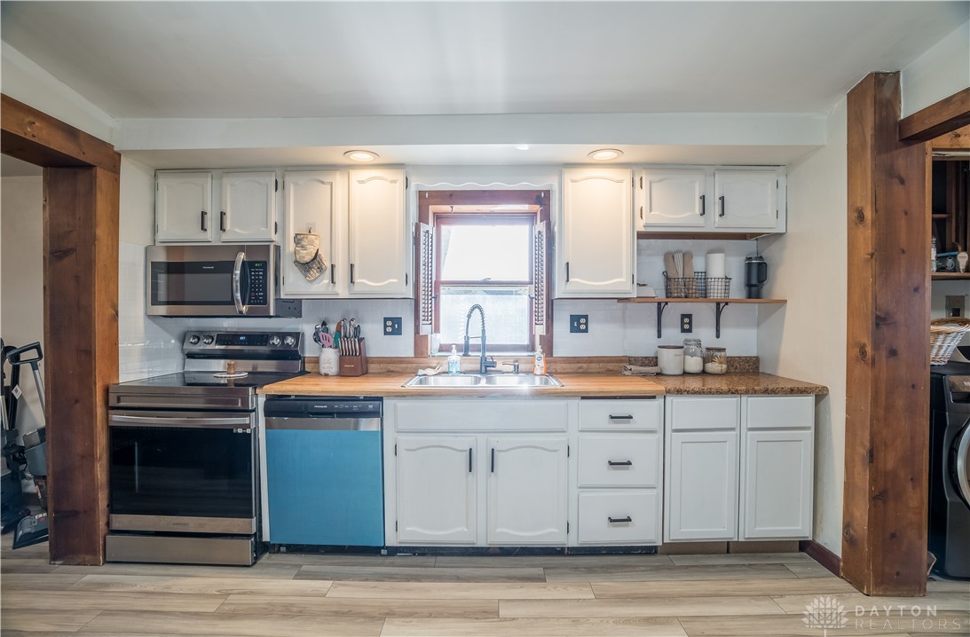 220 Racer Street Troy, OH 45373 - Photo 11 of 33 This bright and functional kitchen features ample cabinetry and modern appliances that will convey.