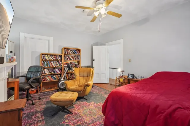 a bedroom with furniture and a chandelier