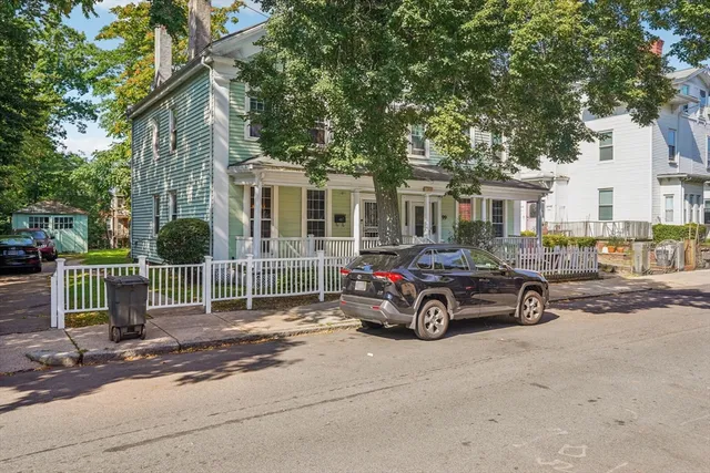 a car parked in front of a house