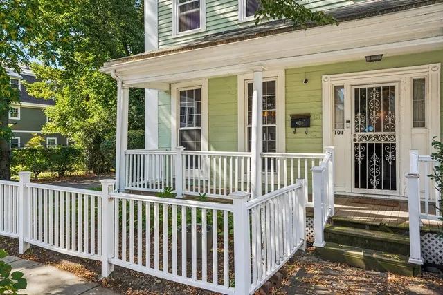 a view of a house with a wooden deck