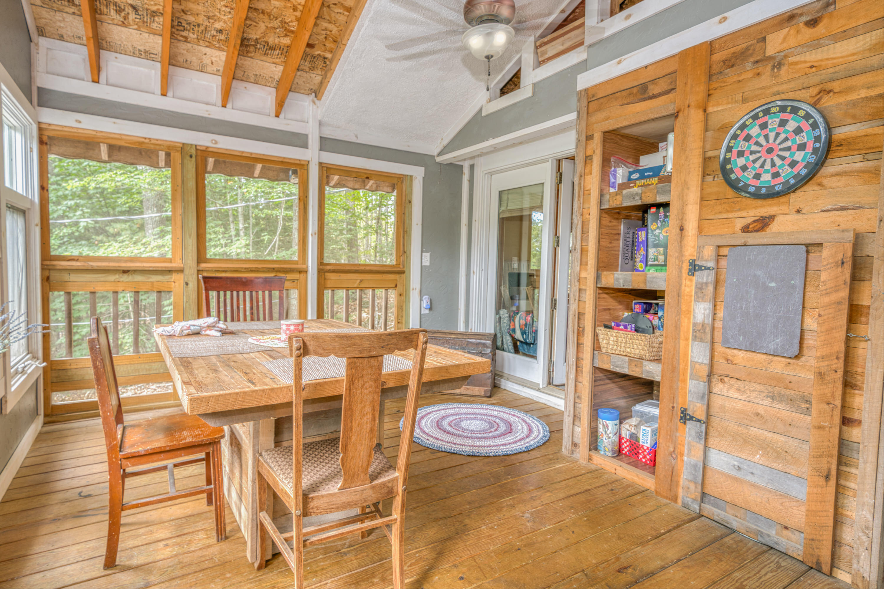 999 Brewer Lake Road Orrington, ME 04474 - Photo 27 of 36 Screened porch toward side wall and livi