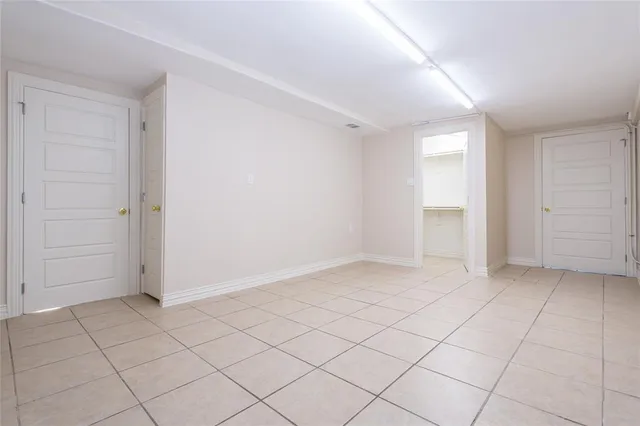 a view of a kitchen with stainless steel appliances kitchen island granite countertop a refrigerator and a stove top oven