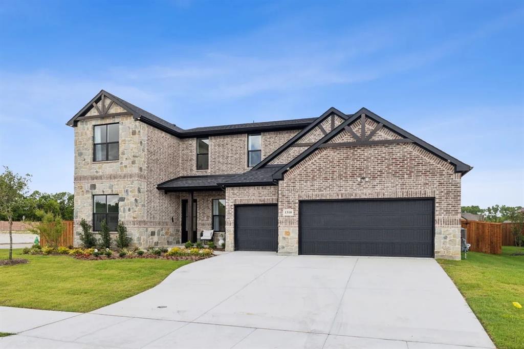 1310 Benjamin Trail Van Alstyne, TX 75495 - Photo 2 of 27 View of front facade featuring stone siding, a garage, concrete driveway, and brick siding