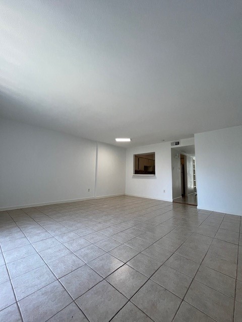 6201 Ranchester Drive, Unit 11 Houston, TX 77036 - Photo 4 of 12 an empty room with a empty space and windows