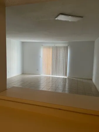 an empty room with wooden floor