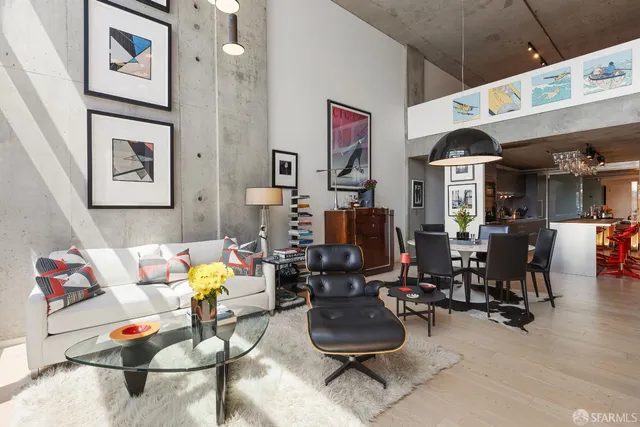 a living room with furniture and white walls