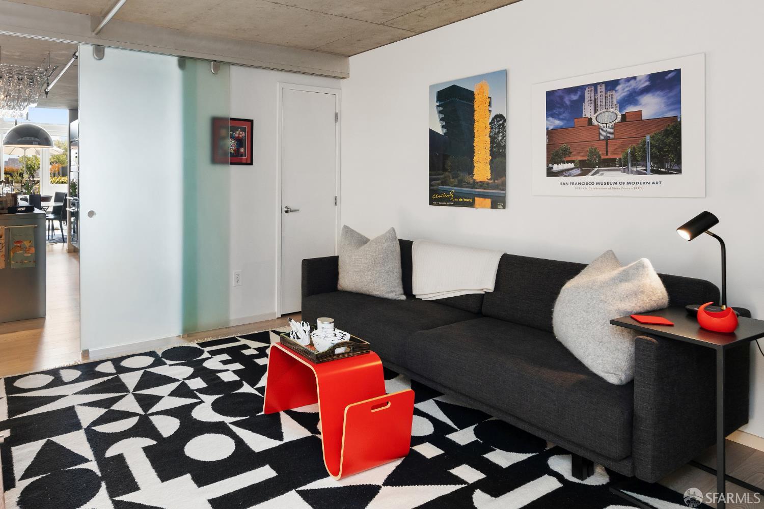 855 Folsom Street, Unit 519 San Francisco, CA 94107 - Photo 13 of 25 a living room with furniture and wooden floor