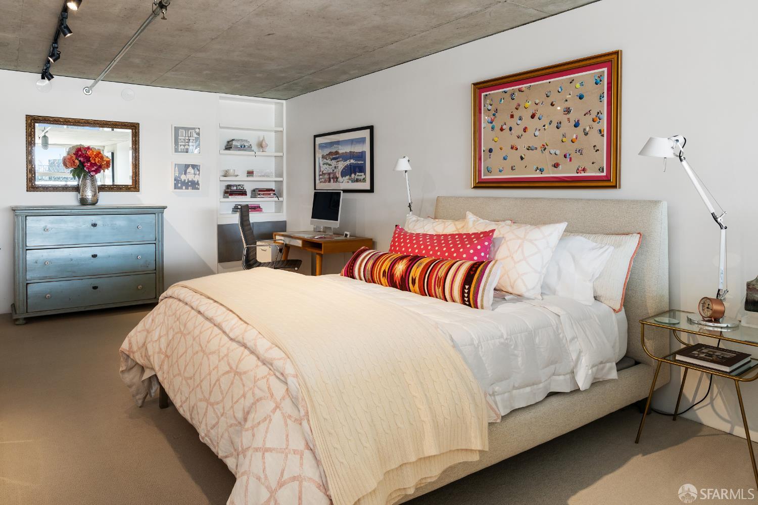 855 Folsom Street, Unit 519 San Francisco, CA 94107 - Photo 17 of 25 a bedroom with a bed and a painting on the wall