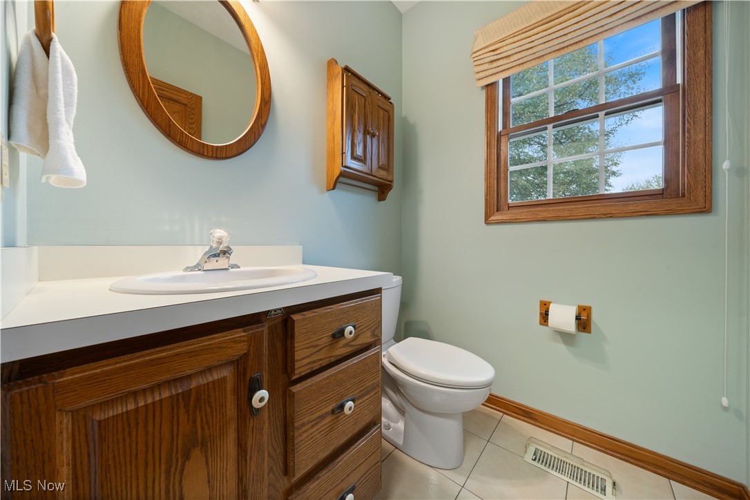 891 Station Road Valley City, OH 44280 - Photo 24 of 45 Bathroom with vanity, toilet, and tile patterned flooring