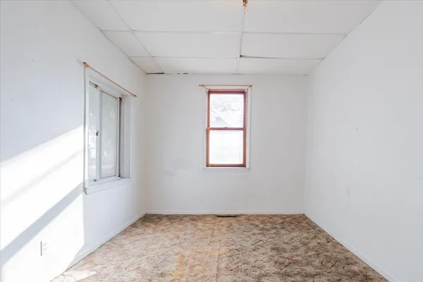 a view of an empty room and window