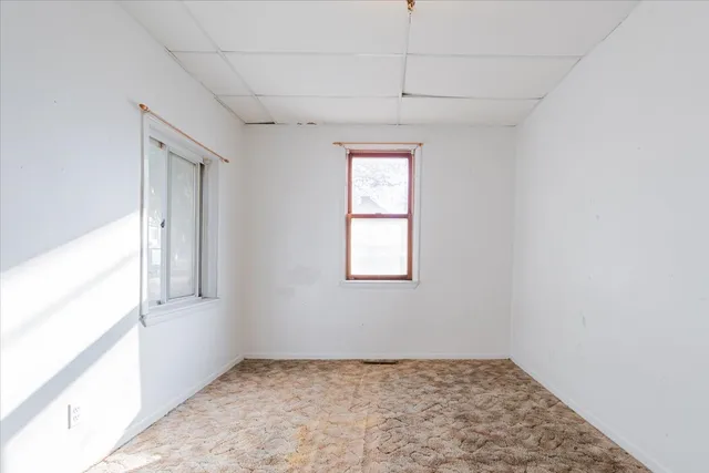 a view of an empty room and window