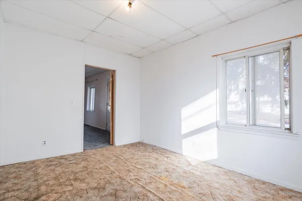 a view of an empty room with a window