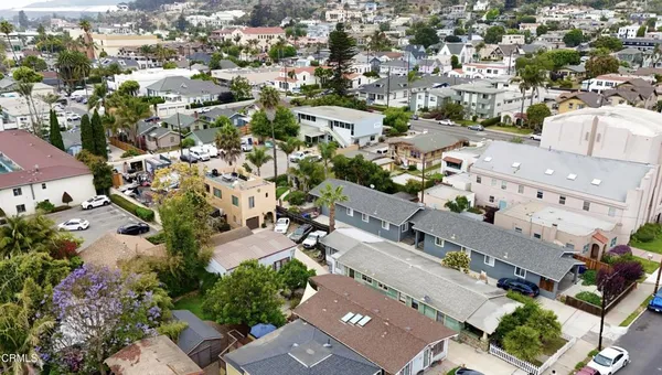 an aerial view of residential houses with outdoor space